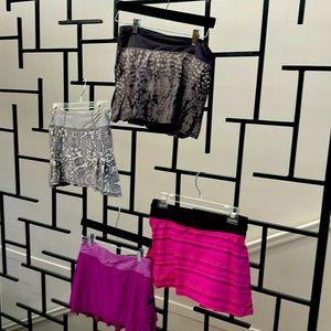 Set of 4 tennis skirts .